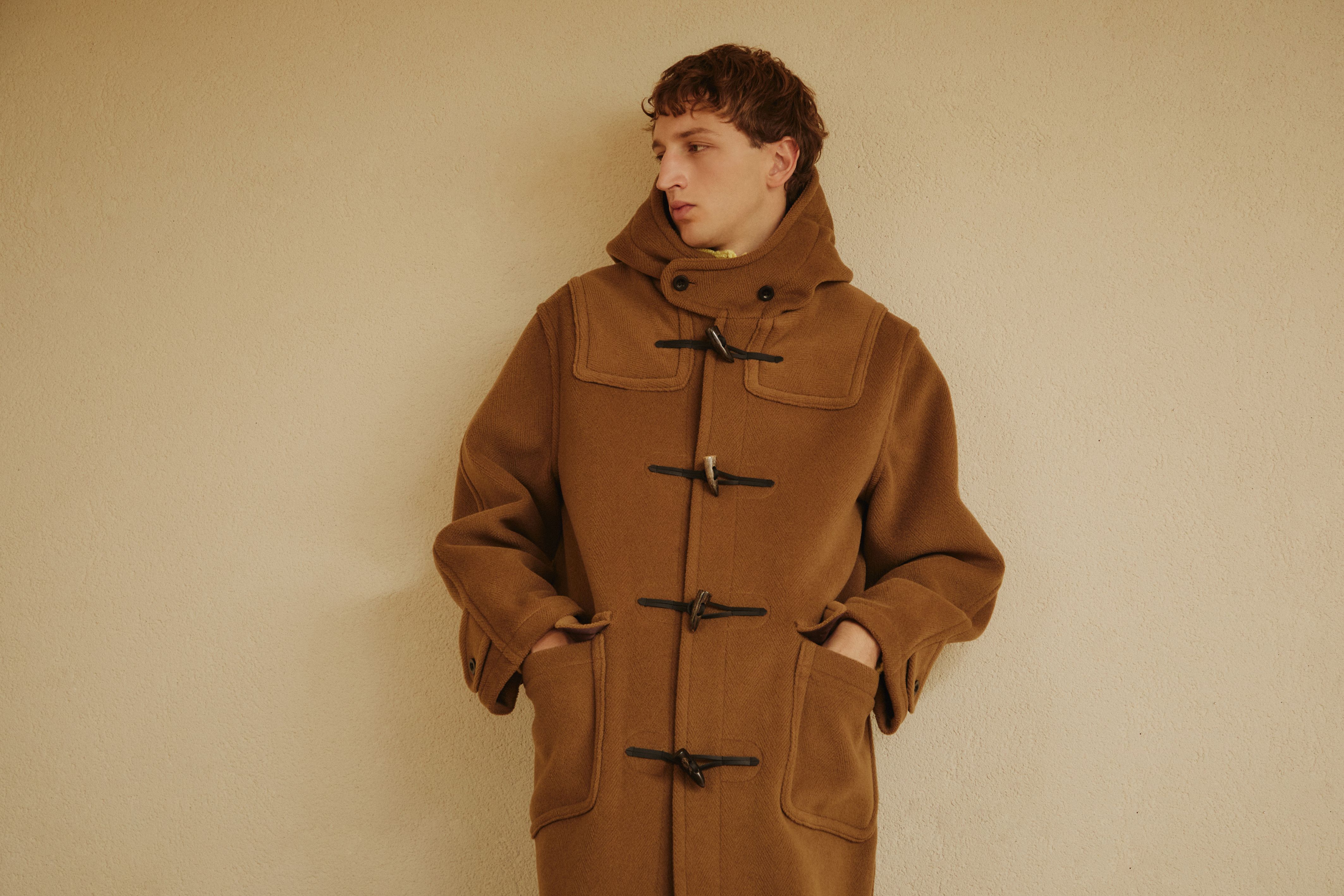 Model wearing a camel GLENMORE duffle coat