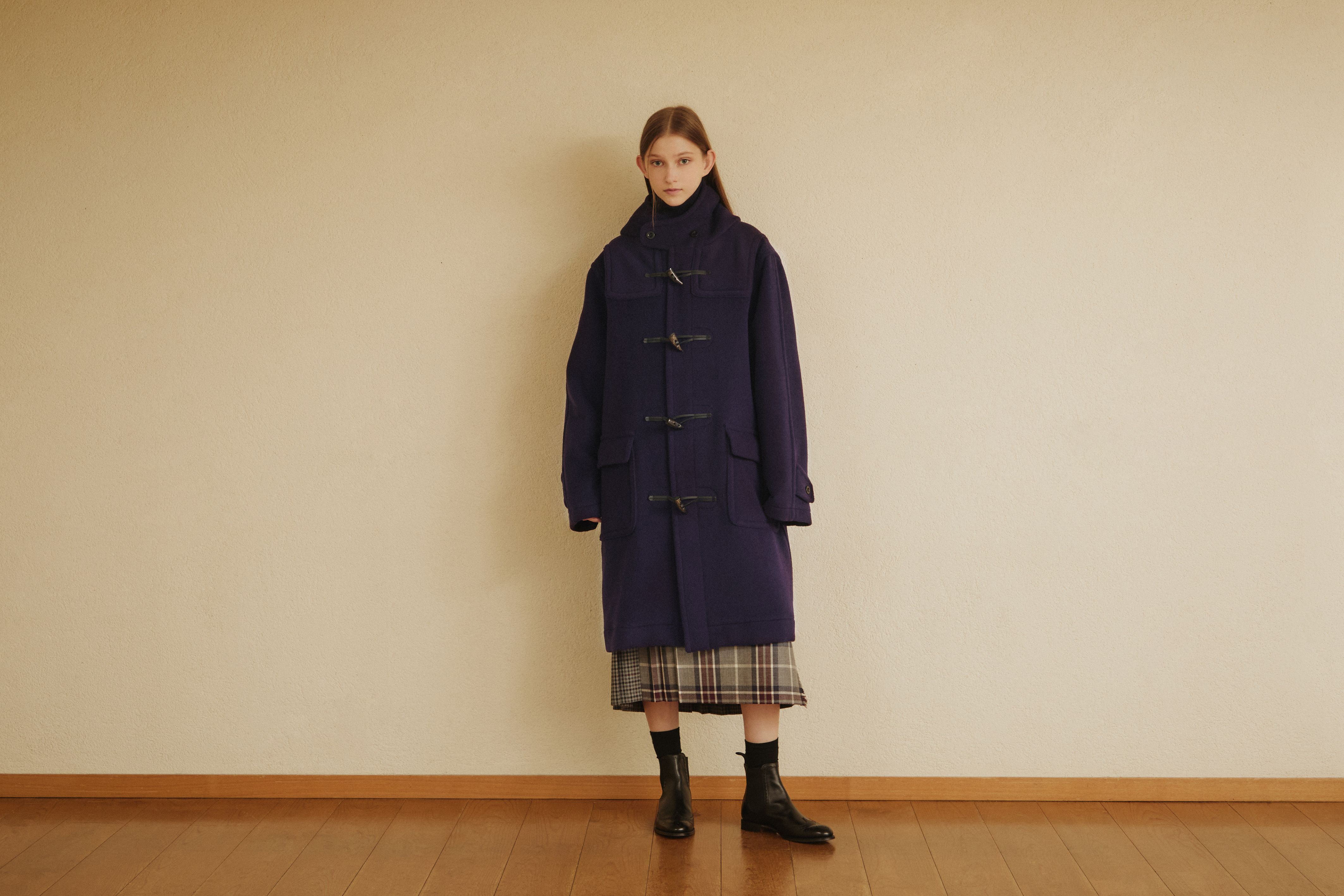 Model wearing a navy GLENMORE duffle coat